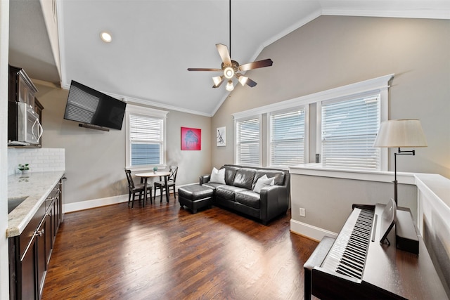 436 W 26th St, Houston, TX 77008 - living room with vaulted ceiling, a ceiling fan, dark wood-style floors, ornamental molding, and baseboards