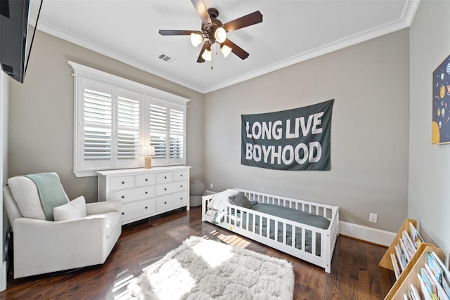 436 W 26th St, Houston, TX 77008 - bedroom with a crib, crown molding, wood finished floors, and baseboards