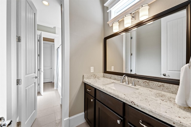 436 W 26th St, Houston, TX 77008 - bathroom featuring tile patterned floors, vanity, and baseboards
