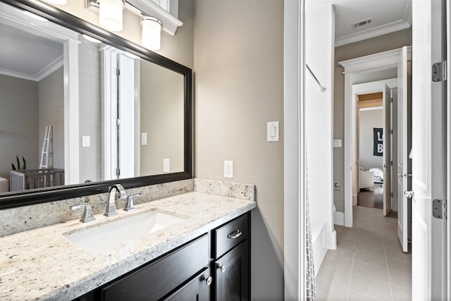 436 W 26th St, Houston, TX 77008 - bathroom featuring ornamental molding, vanity, tile patterned floors, and baseboards