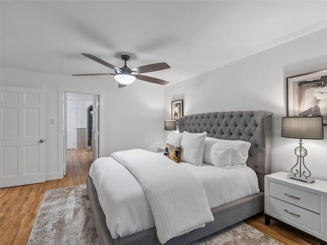 bedroom with wood finished floors and ceiling fan