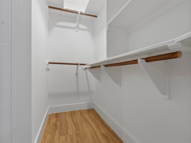 spacious closet with light wood-style floors