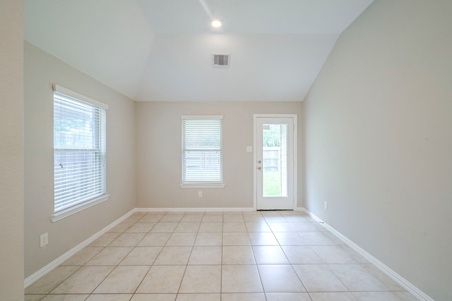 16702 Peralta Bay Cir, Crosby, TX 77532 - empty room featuring vaulted ceiling, light tile patterned floors, and baseboards