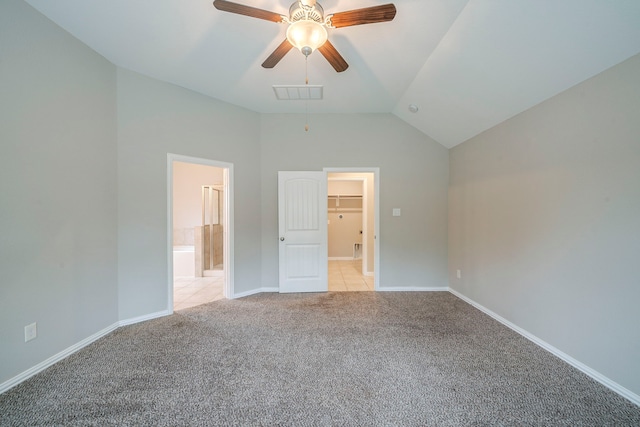 16702 Peralta Bay Cir, Crosby, TX 77532 - unfurnished bedroom with light carpet, vaulted ceiling, baseboards, a spacious closet, and connected bathroom