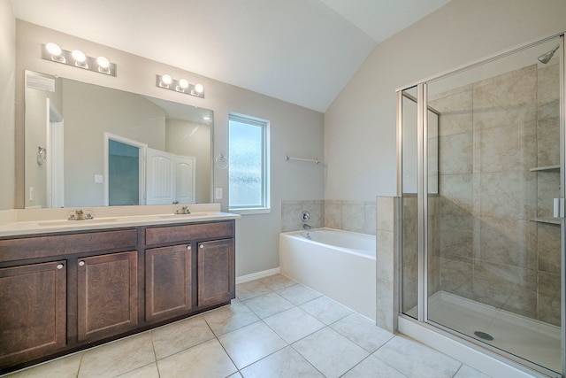 16702 Peralta Bay Cir, Crosby, TX 77532 - full bath with lofted ceiling, a shower stall, a bath, tile patterned floors, and double vanity