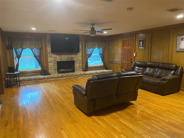 20706 Northcreek Ln, Houston, TX 77073 - living area with a fireplace, light wood-style flooring, and ceiling fan
