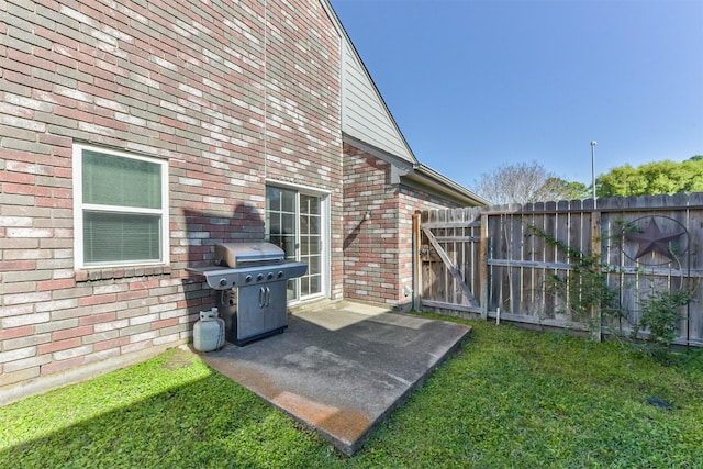 view of patio / terrace with area for grilling and a gate