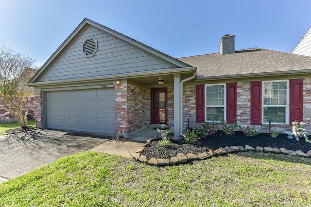 ranch-style home with driveway, an attached garage, brick siding, a front yard, and a chimney