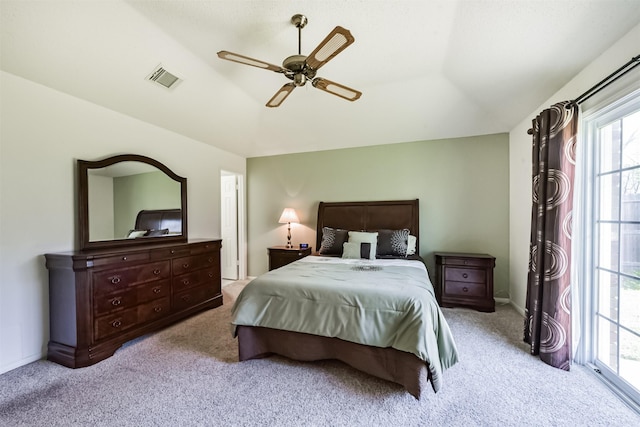 carpeted bedroom with ceiling fan and baseboards
