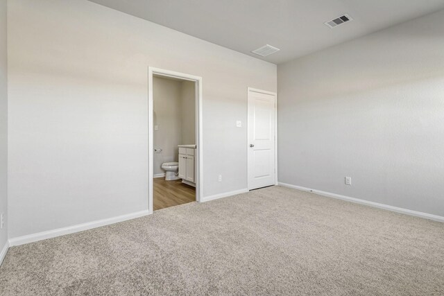 8025 Alpine Bearberry Dr, Houston, TX 77016 - unfurnished bedroom with carpet and ensuite bathroom