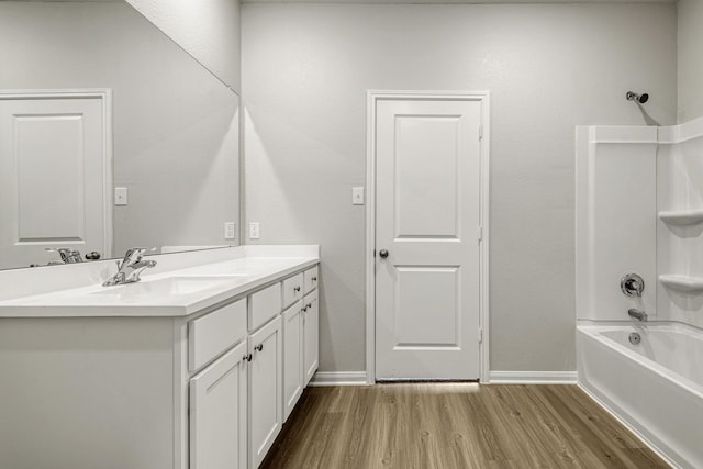 8025 Alpine Bearberry Dr, Houston, TX 77016 - full bathroom featuring vanity, wood finished floors, and  shower combination
