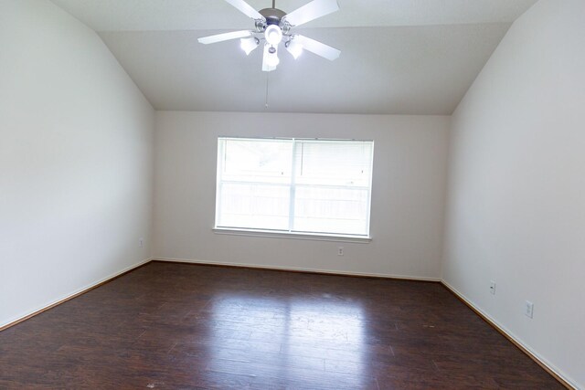 unfurnished room with vaulted ceiling, a ceiling fan, wood finished floors, and baseboards