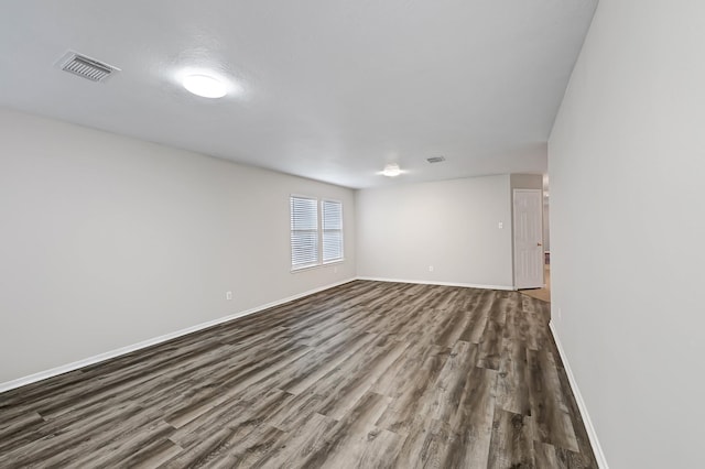 14418 Cellini Dr, Cypress, TX 77429 - empty room featuring dark wood-style flooring and baseboards