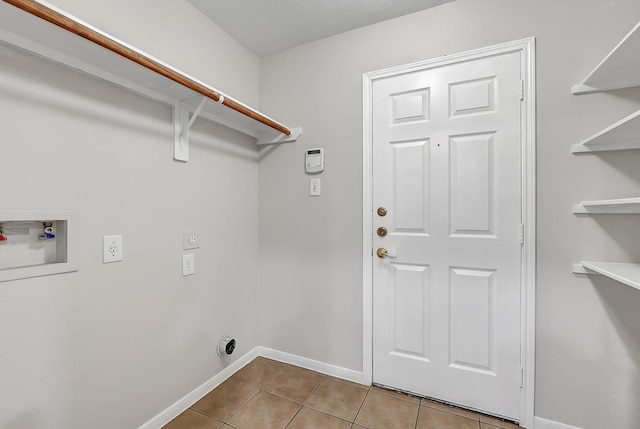 14418 Cellini Dr, Cypress, TX 77429 - laundry area with hookup for an electric dryer, tile patterned flooring, washer hookup, and baseboards