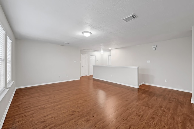 14418 Cellini Dr, Cypress, TX 77429 - spare room featuring wood finished floors, baseboards, and a textured ceiling