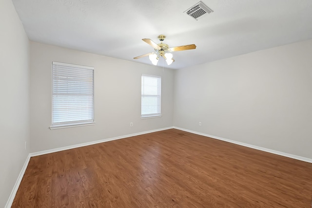 14418 Cellini Dr, Cypress, TX 77429 - empty room featuring wood finished floors, ceiling fan, and baseboards