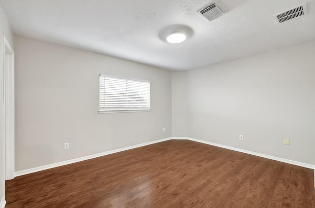 14418 Cellini Dr, Cypress, TX 77429 - spare room with dark wood-type flooring and baseboards