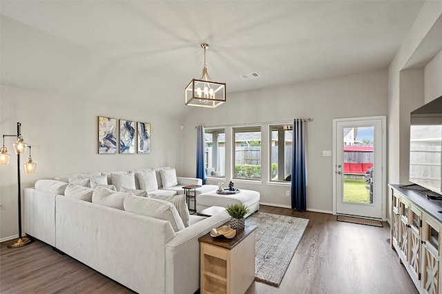 3306 Old Ironwood Dr, Spring, TX 77386 - living room featuring wood finished floors, a chandelier, and baseboards