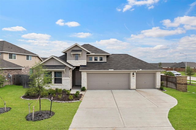 3306 Old Ironwood Dr, Spring, TX 77386 - view of front of home with driveway, stucco siding, stone siding, and an attached garage
