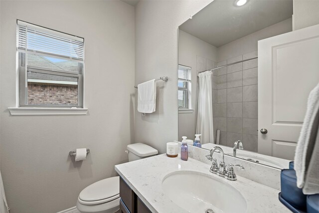 3306 Old Ironwood Dr, Spring, TX 77386 - bathroom with toilet, vanity, curtained shower, and baseboards