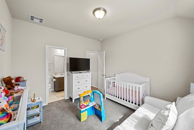 3306 Old Ironwood Dr, Spring, TX 77386 - carpeted bedroom with vaulted ceiling, a sink, and ensuite bath