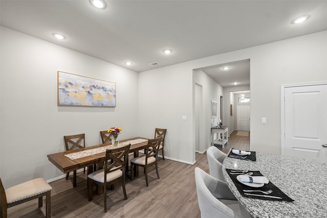 3306 Old Ironwood Dr, Spring, TX 77386 - dining space with light wood-style floors, baseboards, and recessed lighting