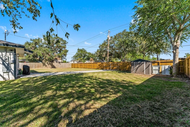 1314 W 4th St, Freeport, TX 77541 - view of yard with a storage unit and an outbuilding