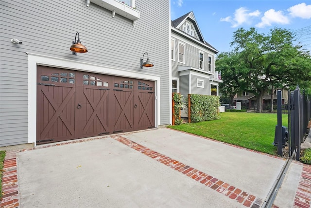 215 Bayland Ave, Houston, TX 77009 - view of property exterior with a yard, an attached garage, and concrete driveway