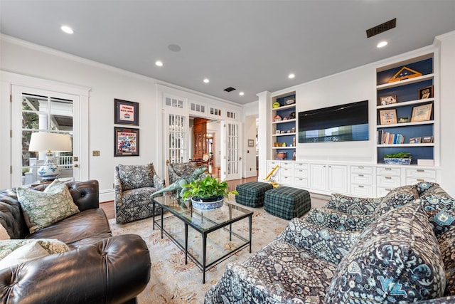 215 Bayland Ave, Houston, TX 77009 - living room with ornamental molding, recessed lighting, baseboards, french doors, and built in features