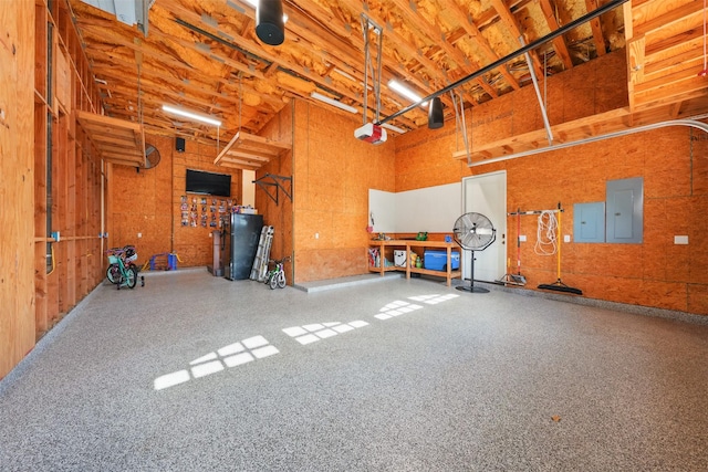 215 Bayland Ave, Houston, TX 77009 - garage featuring a garage door opener and electric panel