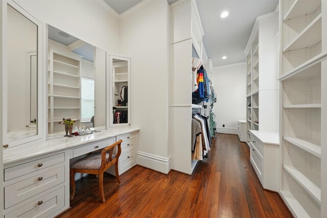 215 Bayland Ave, Houston, TX 77009 - walk in closet featuring dark wood-type flooring and built in study area