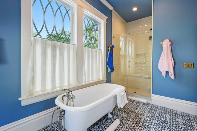 215 Bayland Ave, Houston, TX 77009 - bathroom featuring a stall shower, a freestanding bath, and recessed lighting