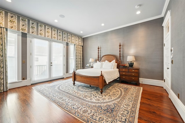 215 Bayland Ave, Houston, TX 77009 - bedroom featuring access to exterior, wood finished floors, crown molding, baseboards, and wallpapered walls