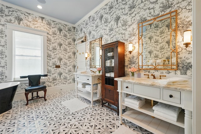 215 Bayland Ave, Houston, TX 77009 - full bath featuring ornamental molding, a soaking tub, two vanities, and wallpapered walls
