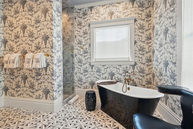 215 Bayland Ave, Houston, TX 77009 - full bath featuring a stall shower, a freestanding bath, and baseboards
