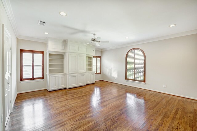 unfurnished bedroom featuring ornamental molding, baseboards, light wood-style floors, recessed lighting, and a ceiling fan