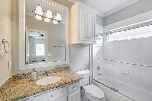 full bathroom featuring plenty of natural light, toilet, shower / bath combination with glass door, vanity, and crown molding