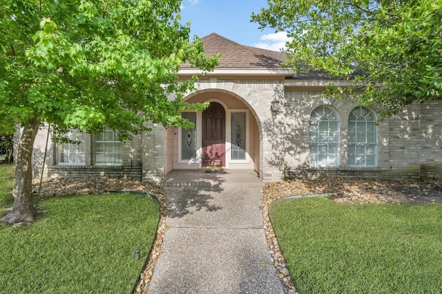 1803 Quiet Country Ct, Houston, TX 77345 - view of front facade featuring brick siding, a shingled roof, and a front yard