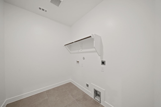 21250 Blue Bluff Dr, Cypress, TX 77433 - laundry room with electric dryer hookup, gas dryer hookup, baseboards, hookup for a washing machine, and light tile patterned floors