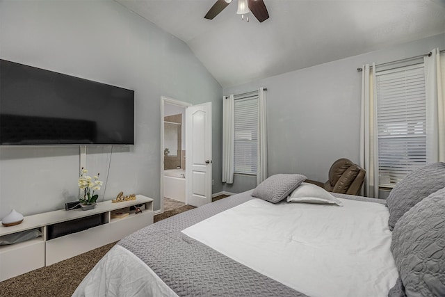 carpeted bedroom featuring vaulted ceiling, ensuite bath, a ceiling fan, and baseboards