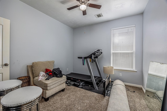workout room with carpet flooring, ceiling fan, and baseboards