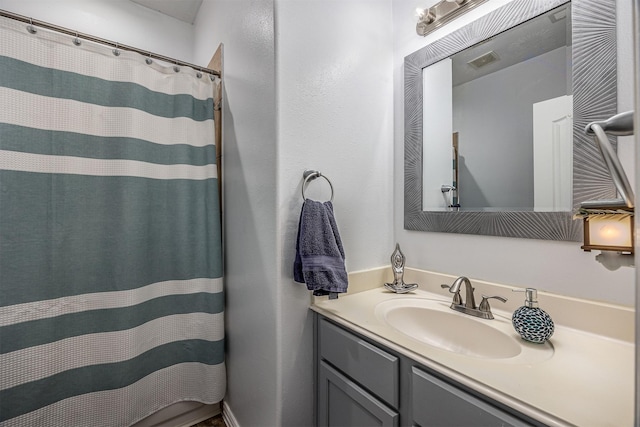 bathroom featuring vanity and a shower with curtain