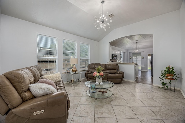 living room with arched walkways, a chandelier, lofted ceiling, and baseboards