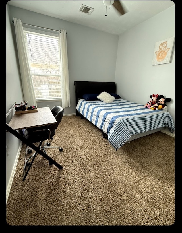 3803 Hunters Trl, Baytown, TX 77521 - bedroom with carpet flooring, baseboards, and a ceiling fan