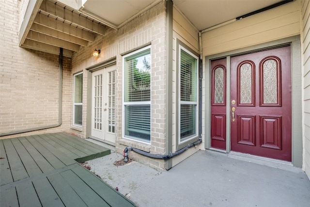 property entrance with brick siding