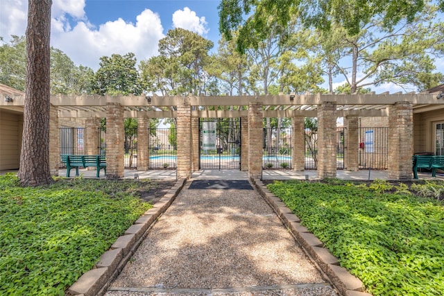 view of home's community featuring fence and a pool