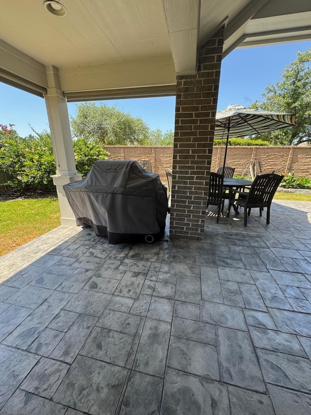 7010 Goldstrum Way, Katy, TX 77493 - fenced backyard with outdoor dining space, a patio area, and grilling area