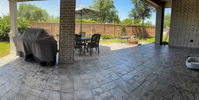 7010 Goldstrum Way, Katy, TX 77493 - fenced backyard with outdoor dining area, a patio area, and a grill
