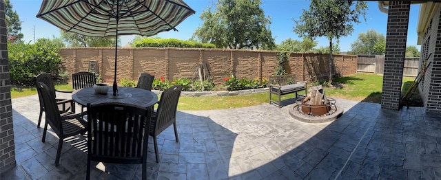 7010 Goldstrum Way, Katy, TX 77493 - fenced backyard with outdoor dining space and a patio