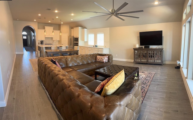 7010 Goldstrum Way, Katy, TX 77493 - living area with a ceiling fan, arched walkways, baseboards, wood finished floors, and recessed lighting